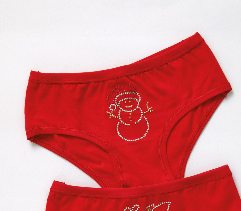 Slip bambina con disegni in borchie a fantasia natale